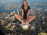 collage city mega clothed barefoot buildings smiling skyscraper looking_at_viewer downward_angle lowerrider mile_high_mikayla