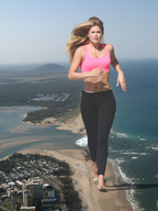 giantess collage long_hair clothed beach barefoot ocean buildings wonderslug running foot_print sand jogging waterfront doutzen_kroes