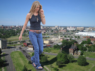 giantess collage long_hair clothed buildings wonderslug sandals walking foot_print streets sky flip_flops jennifer_aniston