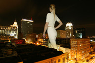 giantess collage city blonde clothed buildings wonderslug night rooftop behind_view city_lights holding_vehicle