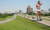 giantess collage city blonde cleavage buildings wonderslug shorts highway vehicles bikini_top roller_blades