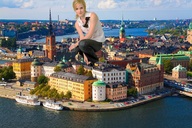 giantess collage mega blonde buildings unknown_artist kneeling town boats emma_watson looking_at_viewer waterfront stockholm