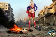 breasts giantess collage mega blonde destruction rampage buildings superhero boots supergirl fire rubble outfit smoke belt hands_on_hips debris dc_comics littlebee bizarro