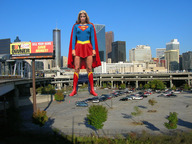 breasts giantess collage city mega blonde skirt wonderslug boots supergirl skyscraper sky parking_lot cape looking_at_viewer helen_slater cracked_pavement dc_comics billboard bare_legs