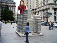 giantess collage small_man city blonde buildings wonderslug camera earrings hilary_duff courtyard behind_building looking_at_tiny