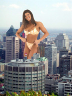 breasts giantess collage city mega swimsuit cleavage brunette smiling wonderslug skyscraper athletic looking_at_viewer hands_on_hips rooftop_view navel_ring