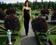 giantess brunette wonderslug walking garden looking_at_viewer shrubs pathway