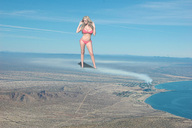 breasts collage landscape city mega blonde large_breasts long_hair swimsuit ocean desert wonderslug sandals navel legs belly looking_down mountains smoke clouds outdoors flip_flops bikini_top bikini_bottom factory legs_spread chimney gisele industrial_area