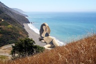 giantess collage swimsuit beach ocean brunette wonderslug lying_down sand mountains coast