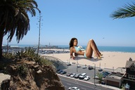 giantess collage swimsuit ocean high_heels helicopter wonderslug lying_down sand dark_skin looking_at_viewer chanta_patton