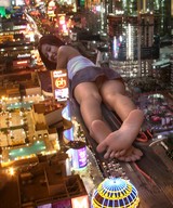 collage city barefoot buildings soles asian lying_down streets vehicles looking_at_viewer rooftop_view city_lights