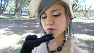 gentle collage handheld finger gloves shrunken_man outdoors hat necklace looking_at_tiny