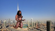 giantess collage city mega unknown_artist kneeling muscles burj_khalifa skyscraper dark_skin sky looking_at_viewer dubai dayana_cadeau