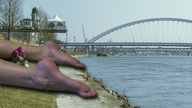 giantess collage bridge small_woman barefoot buildings soles lying_down grass sidewalk waterfront eci999