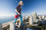 giantess collage city blonde clothed beach ocean buildings shoes sand sky looking_at_viewer docop taylor_swift