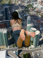 giantess collage city barefoot buildings soles brunette lying_down unknown_artist streets downward_angle