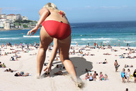giantess collage small_man blonde beach water buildings wonderslug sand grabbing behind_view frankie_essex