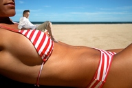 swimsuit beach lying_down shrunken_men shrunken_man dark_skin outdoors