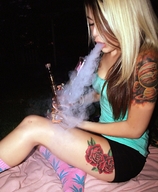 breasts collage nude blonde barefoot smoking shrunken_woman tattoo ankles green_top on_body black_shorts bong