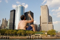 collage giant shorts shirtless outdoors looking_into_distance