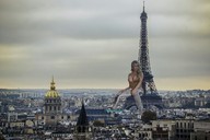 breasts giantess collage city mega blonde cleavage jeans sitting looking_at_viewer eiffel_tower sitting_on_building zed782