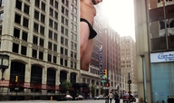 city giant bulge looking_down outdoors facial_hair