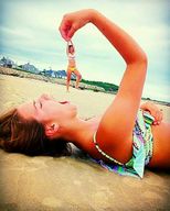 collage beach brunette lying_down shrunken_woman open_mouth between_fingers imminent_vore