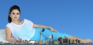 collage city mega barefoot brunette pillow lying_down unknown_artist skyscraper tower sky selena_gomez