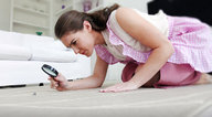 collage micro brunette kneeling shrunken_people magnifying_glass floor inspecting