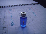 collage inside shrunken_man trapped experiment papers peque vial
