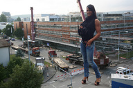 giantess collage high_heels buildings jeans unknown_artist streets construction looking_at_viewer