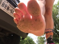 toes soles low_angle sand photograph outdoors dirty_soles point_of_view raised_foot perspective tehhoff