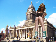 breasts giantess collage mega handheld cleavage glasses brunette sitting vehicles clouds sky looking_at_viewer tennis_shoes sitting_on_building museum ser-gts