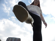 high_heels red_hair foot_crush black_pants point_of_view looking_at_viewer white_blouse imminent_crush