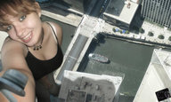 giantess city bridge cleavage buildings smiling river boats looking_up sunny necklace selfie spaghetti_straps hand_on_thigh