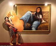 collage feet clothed toes barefoot smiling asian dress mini_giantess sitting painting photograph purse looking_at_viewer sofa pointing reading art_gallery xinhua landov barcroft_media