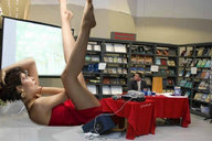 collage barefoot dress lying_down short_hair mini_giantess table books