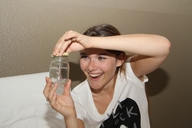 collage handheld finger hand shrunken_woman trapped captured jar looking_at_tiny