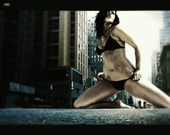 giantess collage city swimsuit clothed barefoot cleavage buildings brunette kneeling onlookers navel_ring penthouse_key_necklace
