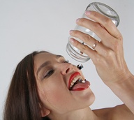 vore clothed teeth brunette smiling shrunken_men open_mouth falling jar red_lips dropped no_background digital_render