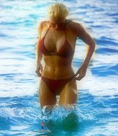 gentle giantess collage blonde long_hair swimsuit clothed cleavage ocean looking_down wading swim_trunks paddleboarding