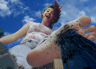 city mega destruction barefoot buildings purple_hair smiling scared shorts running shrunken_people shirt point_of_view raised_foot looking_at_giantess in_fear look_from_above