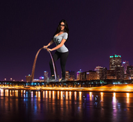 gentle giantess collage city mega black_hair large_breasts long_hair cleavage water boots sunglasses standing reflection night lights shirt clutching stretch_pants gateway_arch captain_rand st_louis jenna_jenovich