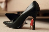 collage clothed high_heels brunette dress shrunken_woman standing hiding blurry