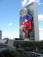breasts giantess collage city mega blonde skirt buildings boots supergirl reflection sky costume cape looking_at_viewer new_york_city belt hands_on_hips dc_comics bare_legs zboczony un_building