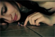 micro black_hair finger playful posing lying_down floor closed_eyes lip_gloss