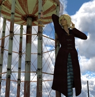 gentle giantess blonde brunette dress standing water_tower digital_render overcoat