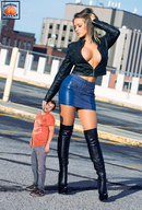 gentle collage long_hair clothed cleavage skirt high_heels brunette boots shrunken_man standing leather jacket squeezemeflat