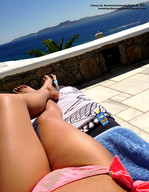 bikini gentle collage clothed barefoot ocean lying_down foot_worship legs shrunken_man pedicure sunbathing towels sunscreen