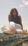 giantess collage city mega jeans brunette sitting medium_length_hair looking_down sneakers outdoors zboczony sleeveless_top